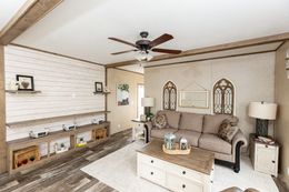 The THE RANCH HOUSE Living Room. This Manufactured Mobile Home features 3 bedrooms and 2 baths.