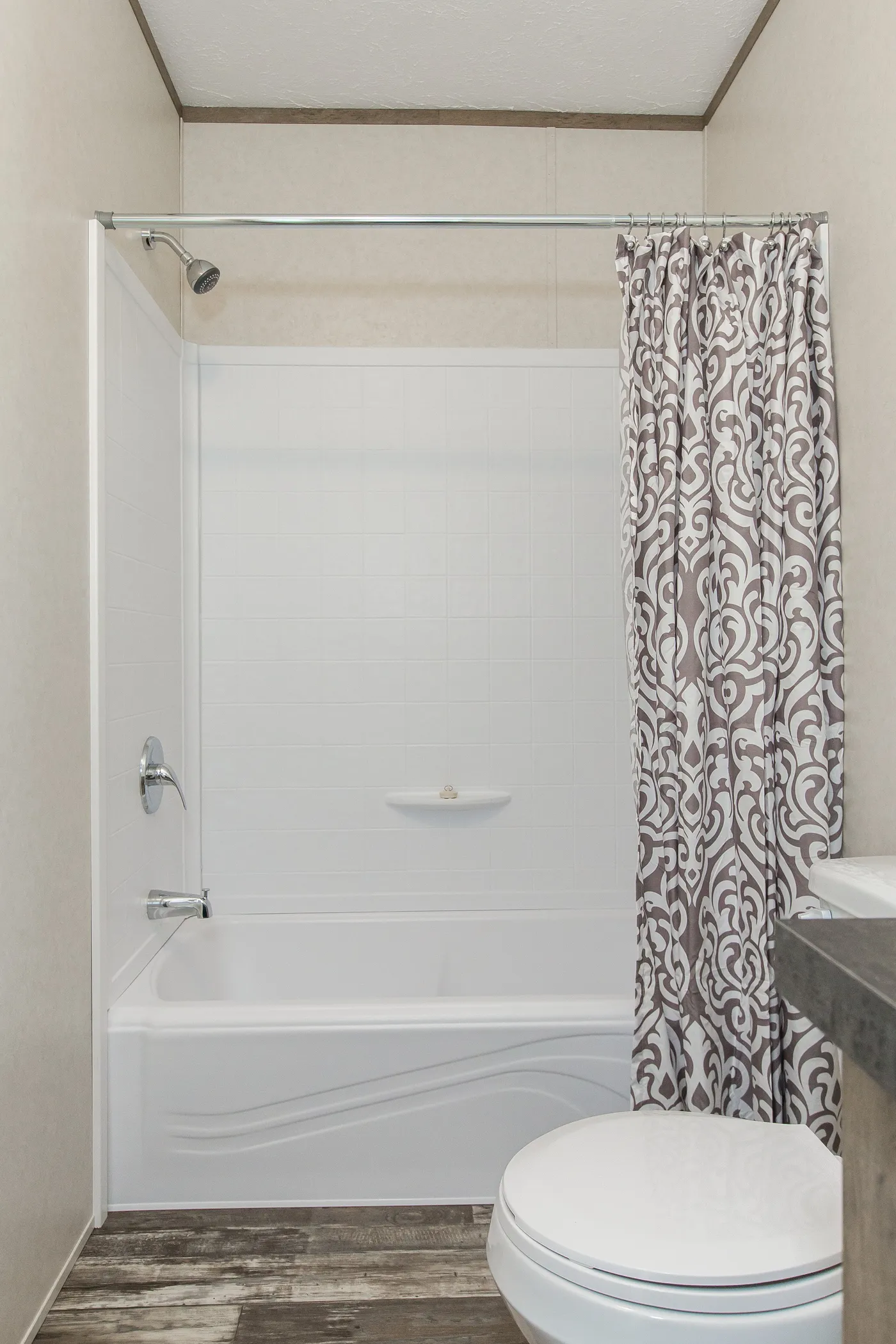 The THE BREEZE Guest Bathroom. This Manufactured Mobile Home features 3 bedrooms and 2 baths.