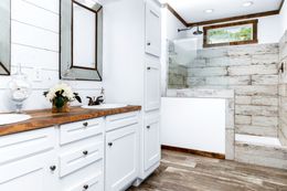 The THE DAISY-MAE Master Bathroom. This Manufactured Mobile Home features 3 bedrooms and 2 baths.