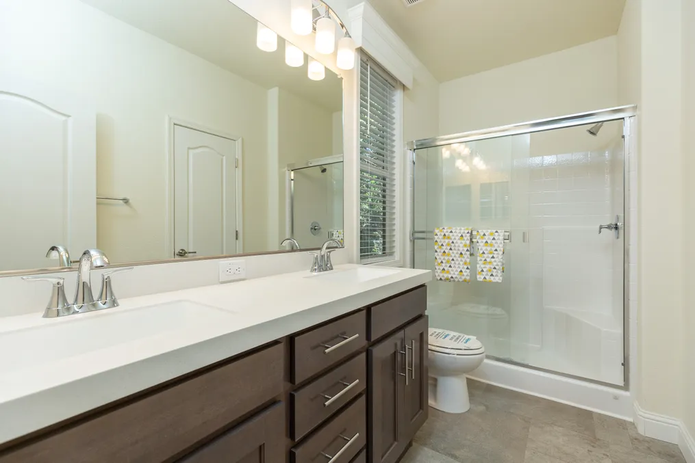The FAIRPOINT 24564A Primary Bathroom. This Manufactured Mobile Home features 4 bedrooms and 2 baths.