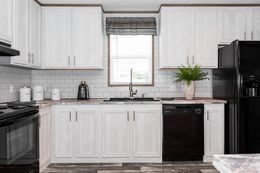 The THE MORRIS Kitchen. This Manufactured Mobile Home features 3 bedrooms and 2 baths.