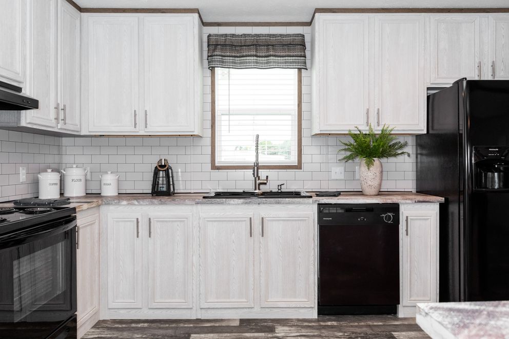 The THE MORRIS Kitchen. This Manufactured Mobile Home features 3 bedrooms and 2 baths.