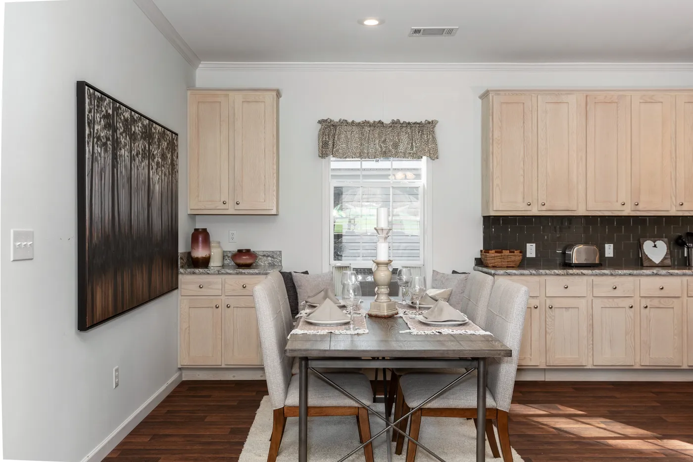 The NORMANDY Dining Room. This Manufactured Mobile Home features 3 bedrooms and 2 baths.
