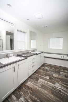 The EBONY Master Bathroom. This Manufactured Mobile Home features 4 bedrooms and 2 baths.