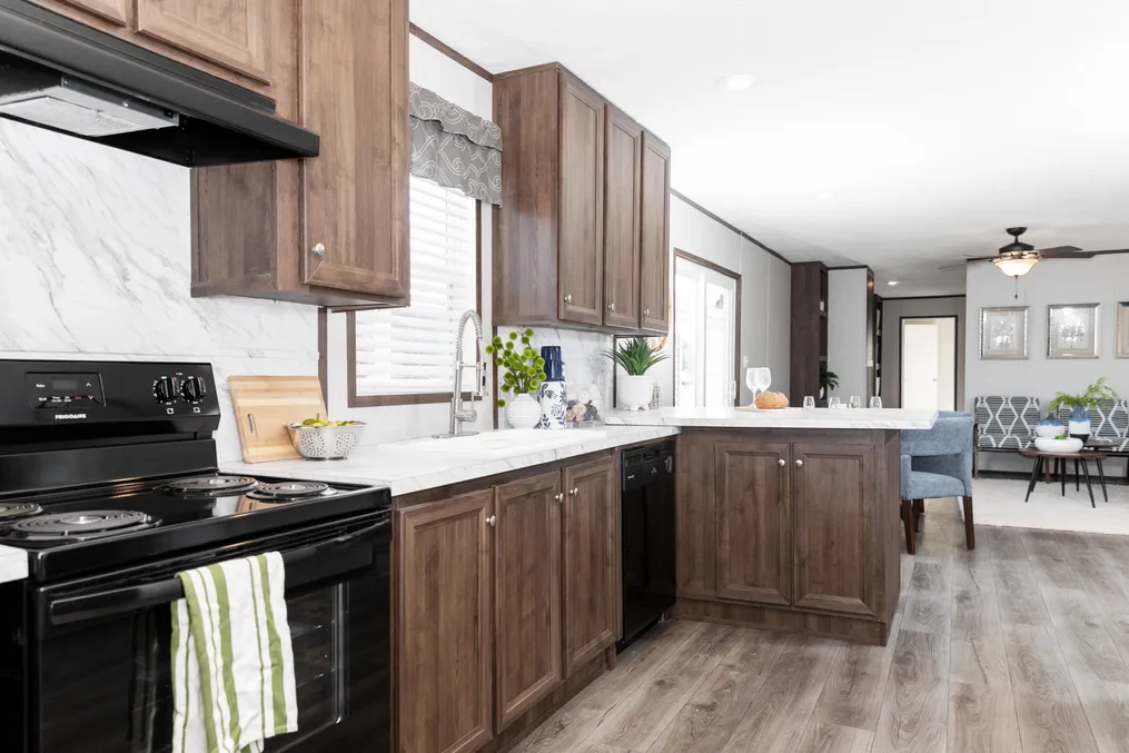 The THE REFLECTIONS Kitchen. This Manufactured Mobile Home features 3 bedrooms and 2 baths.