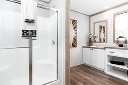 The FARM HOUSE BREEZE 56 Primary Bathroom. This Manufactured Mobile Home features 3 bedrooms and 2 baths.