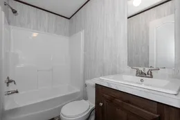 The THE POWERHOUSE Guest Bathroom. This Manufactured Mobile Home features 3 bedrooms and 2 baths.