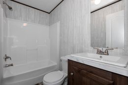 The THE POWERHOUSE Guest Bathroom. This Manufactured Mobile Home features 3 bedrooms and 2 baths.