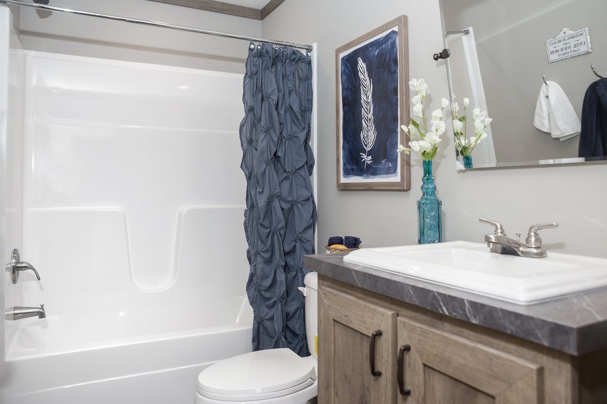 The AIMEE Guest Bathroom. This Manufactured Mobile Home features 3 bedrooms and 2 baths.