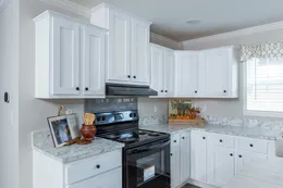 The THE FREEDOM BREEZE Kitchen. This Manufactured Mobile Home features 3 bedrooms and 2 baths.