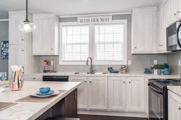 The ULTRA BREEZE 76 Kitchen. This Manufactured Mobile Home features 4 bedrooms and 2 baths.