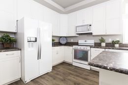 The ENCHANTMENT 3070A Kitchen. This Manufactured Mobile Home features 3 bedrooms and 2 baths.