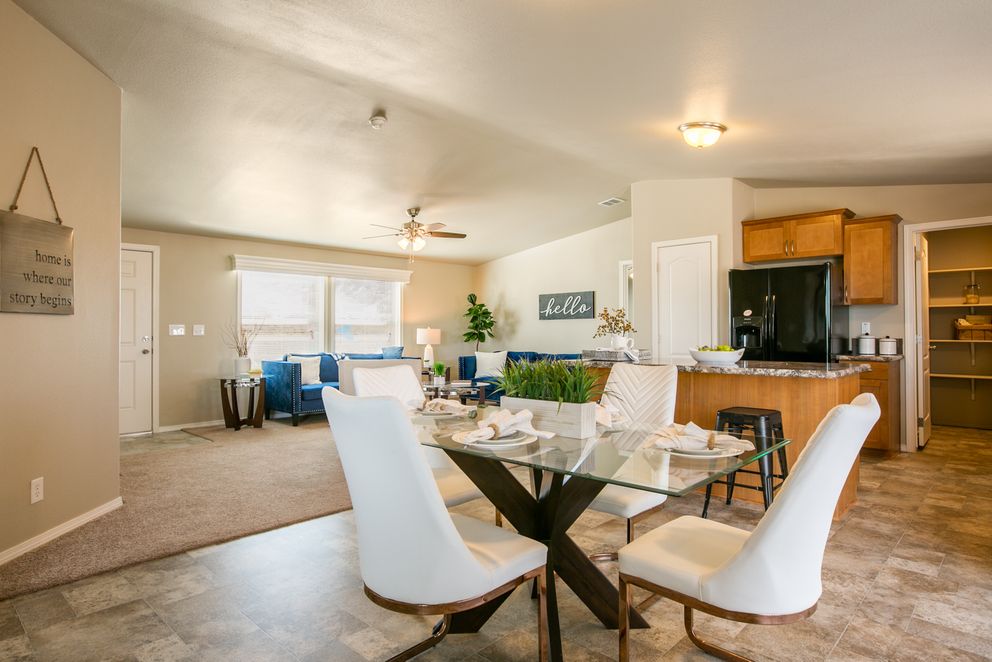The THE WAVE Dining Area. This Manufactured Mobile Home features 4 bedrooms and 2 baths.