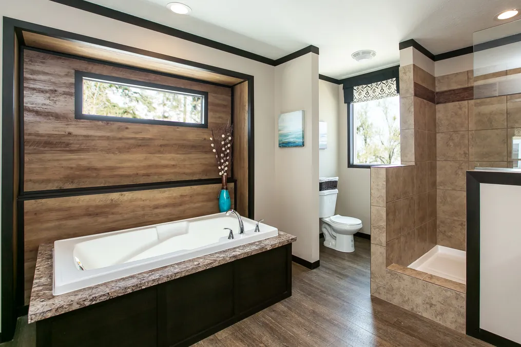 The THE FRANKLIN Primary Bathroom. This Manufactured Mobile Home features 3 bedrooms and 2 baths.