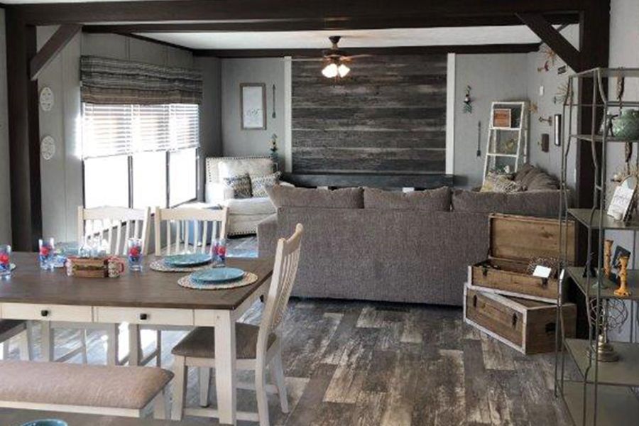 The THE MEADOWBROOK Living Room. This Manufactured Mobile Home features 4 bedrooms and 2 baths.