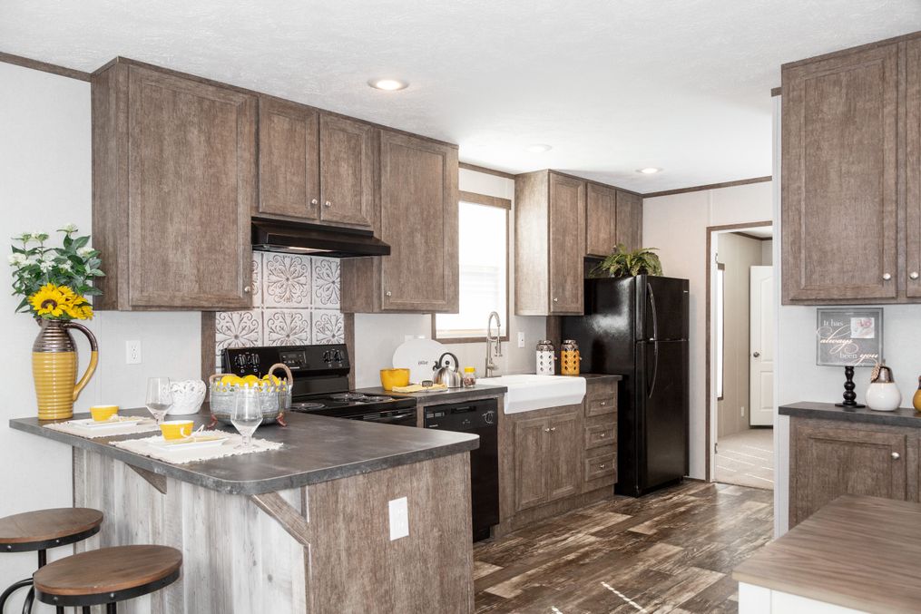 The THE ANNIVERSARY 76 Kitchen. This Manufactured Mobile Home features 3 bedrooms and 2 baths.
