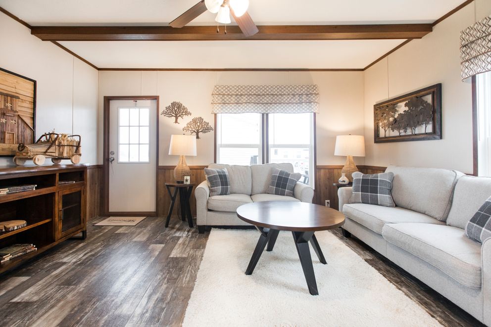 The THE LODGE Living Room. This Manufactured Mobile Home features 2 bedrooms and 2 baths.