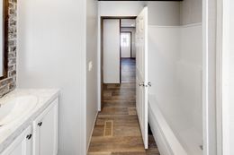 The BREEZE FARMHOUSE 72 Guest Bathroom. This Manufactured Mobile Home features 4 bedrooms and 2 baths.