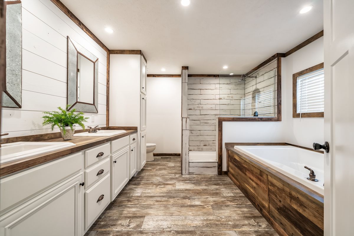 The THE AVALYN Master Bathroom. This Manufactured Mobile Home features 3 bedrooms and 2 baths.