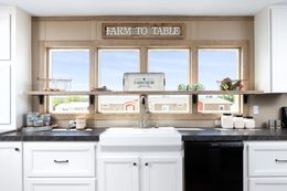 The FARMHOUSE FLEX Kitchen. This Manufactured Mobile Home features 3 bedrooms and 2.5 baths.