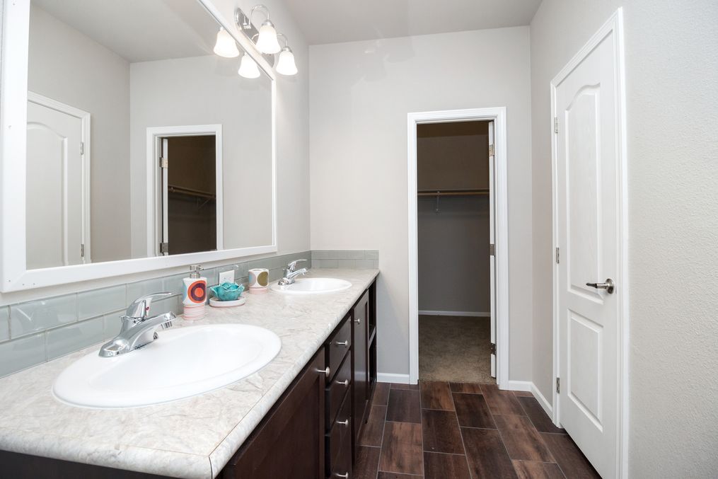 The ARTESIA Primary Bathroom. This Manufactured Mobile Home features 3 bedrooms and 2 baths.