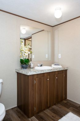 The TRIUMPH Primary Bathroom. This Manufactured Mobile Home features 5 bedrooms and 3 baths.