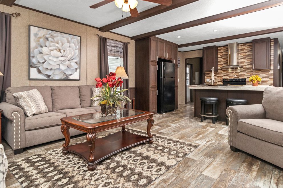 The THE PARKSIDE Living Room. This Manufactured Mobile Home features 3 bedrooms and 2 baths.