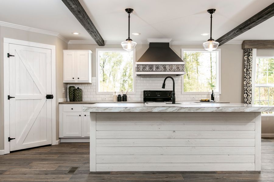 The FREEDOM FARM HOUSE  32X60 Kitchen. This Manufactured Mobile Home features 3 bedrooms and 2 baths.