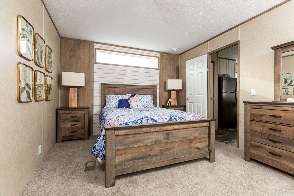 The THE RANCH HOUSE Master Bedroom. This Manufactured Mobile Home features 3 bedrooms and 2 baths.