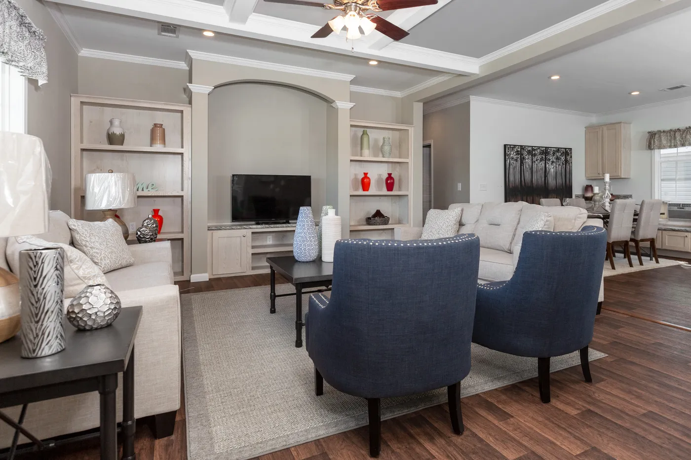 The NORMANDY Living Room. This Manufactured Mobile Home features 3 bedrooms and 2 baths.
