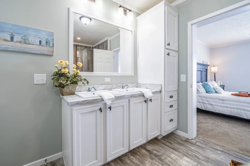 The THE INGRAM Primary Bathroom. This Manufactured Mobile Home features 3 bedrooms and 2 baths.
