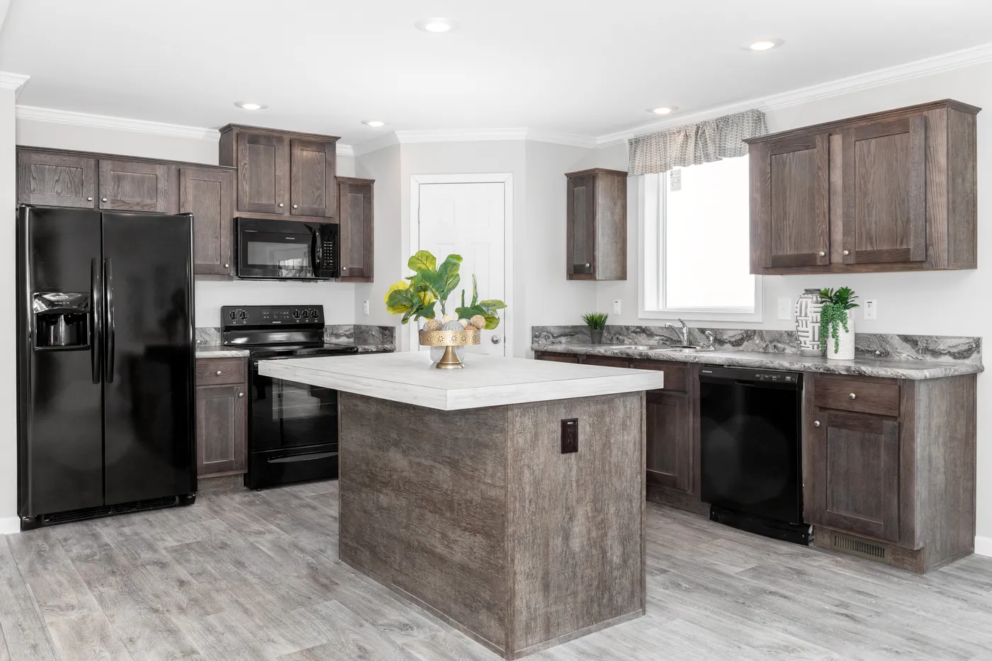 The THE VILLETTE Kitchen. This Manufactured Mobile Home features 3 bedrooms and 2 baths.