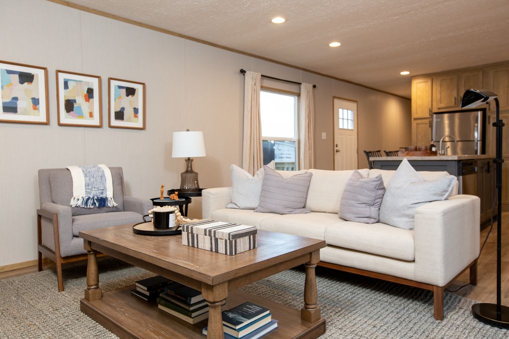 The SYDNEY Living Room. This Manufactured Mobile Home features 3 bedrooms and 2 baths.
