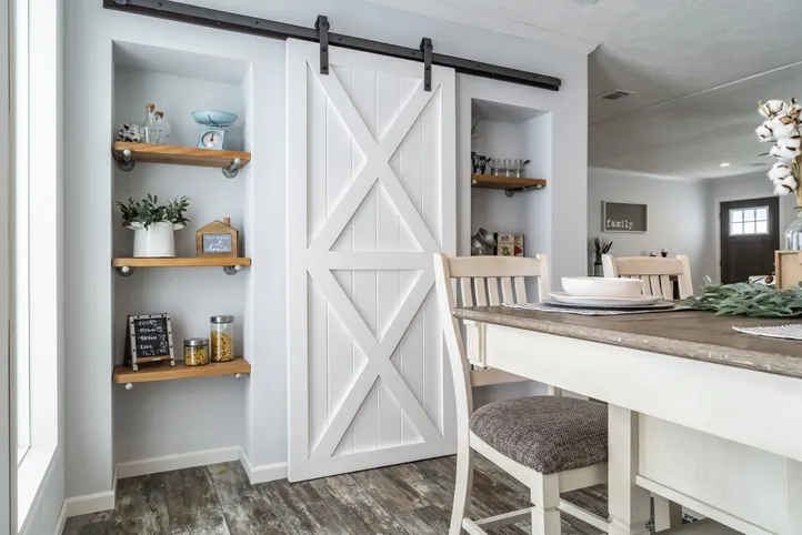The THE LEAHY Dining Area. This Manufactured Mobile Home features 4 bedrooms and 2 baths.