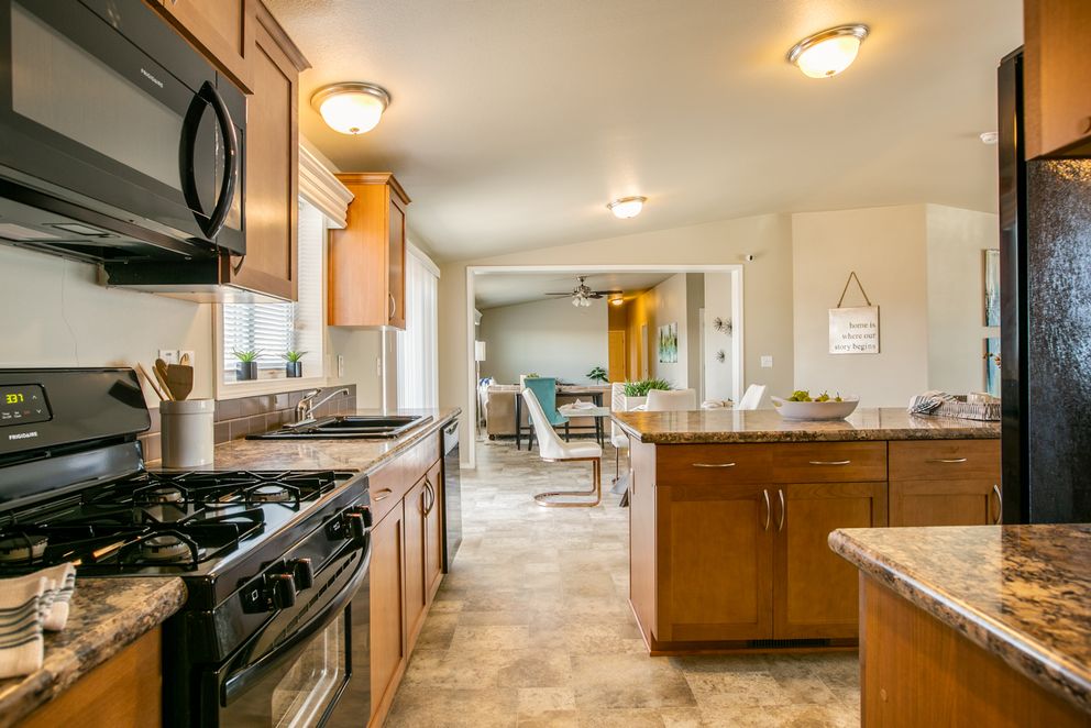 The THE WAVE Kitchen. This Manufactured Mobile Home features 4 bedrooms and 2 baths.