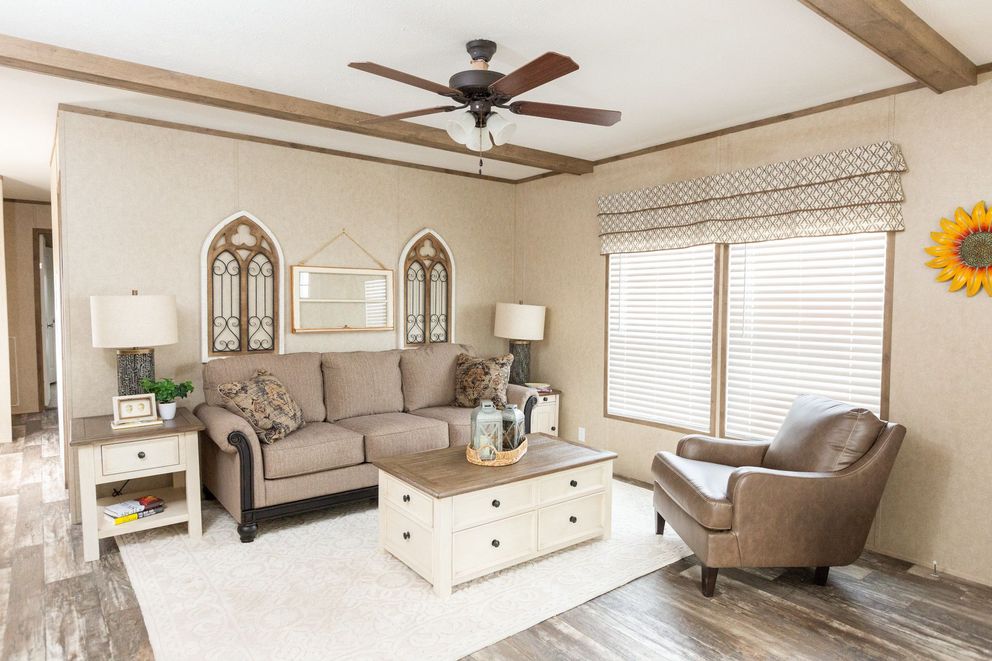 The THE RANCH HOUSE Living Room. This Manufactured Mobile Home features 3 bedrooms and 2 baths.