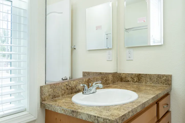 The FAIRPOINT 20523B Primary Bathroom. This Manufactured Mobile Home features 3 bedrooms and 2 baths.