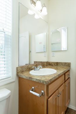 The FAIRPOINT 20523B Primary Bathroom. This Manufactured Mobile Home features 3 bedrooms and 2 baths.