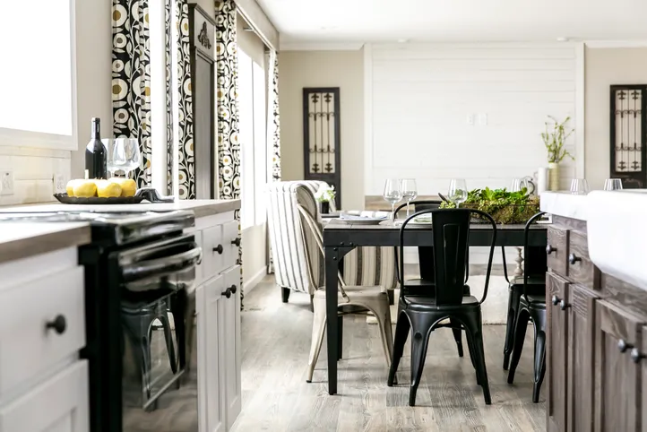 The FREEDOM FARM HOUSE  32X60 Dining Area. This Manufactured Mobile Home features 3 bedrooms and 2 baths.