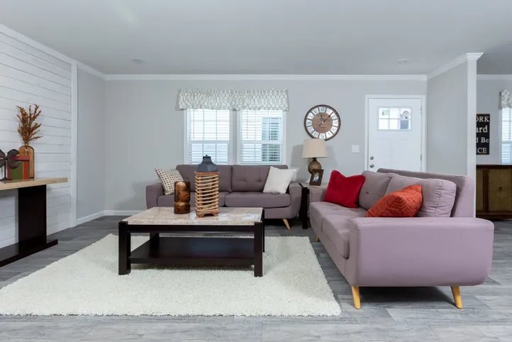The THE FREEDOM BREEZE Living Room. This Manufactured Mobile Home features 3 bedrooms and 2 baths.