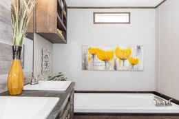The THE ANNIVERSARY 76 Master Bathroom. This Manufactured Mobile Home features 3 bedrooms and 2 baths.