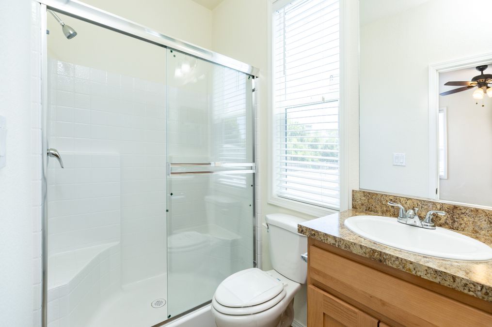 The FAIRPOINT 20523B Primary Bathroom. This Manufactured Mobile Home features 3 bedrooms and 2 baths.
