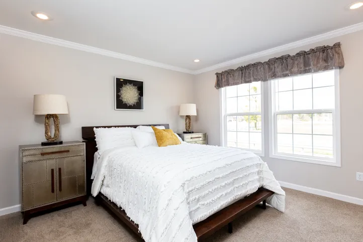 The THE FREEDOM SOHO Primary Bedroom. This Manufactured Mobile Home features 3 bedrooms and 2 baths.