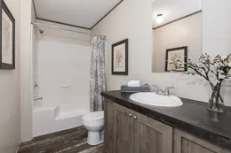 The THE BREEZE Guest Bathroom. This Manufactured Mobile Home features 3 bedrooms and 2 baths.