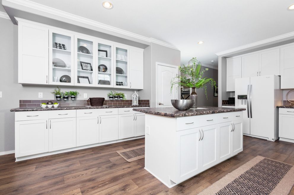 The ENCHANTMENT 3070A Kitchen. This Manufactured Mobile Home features 3 bedrooms and 2 baths.