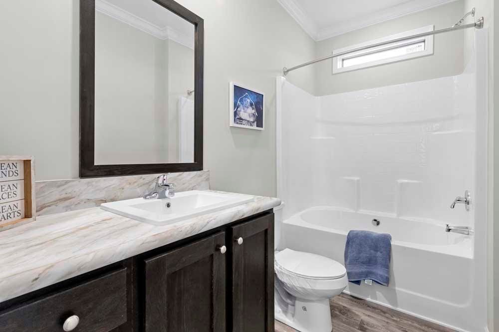 The THE TILLEY Guest Bathroom. This Manufactured Mobile Home features 3 bedrooms and 2 baths.