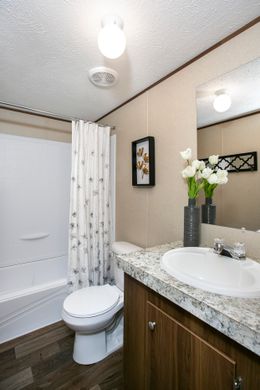 The TRIUMPH Guest Bathroom. This Manufactured Mobile Home features 5 bedrooms and 3 baths.
