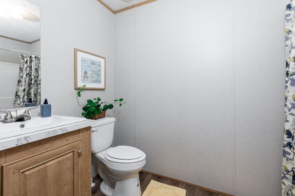 The BLAZER 56 B Primary Bathroom. This Manufactured Mobile Home features 2 bedrooms and 2 baths.