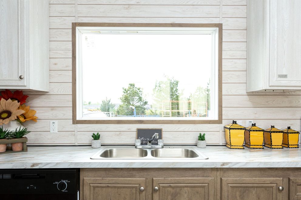 The THE RANCH HOUSE Kitchen. This Manufactured Mobile Home features 3 bedrooms and 2 baths.