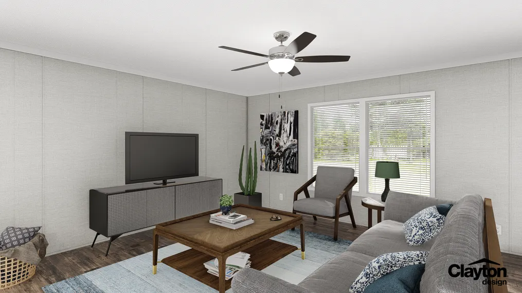 The THE FUSION 32B Living Room. This Manufactured Mobile Home features 4 bedrooms and 2 baths.